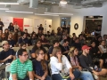 Participantes del Include-a-thon escuchando una conferencia